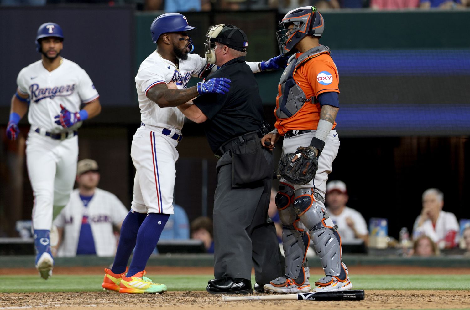 Rangers right fielder Adolis García yells at Astros catcher Martín Maldonado during Game 5 of the ALCS on Oct. 20, 2023.